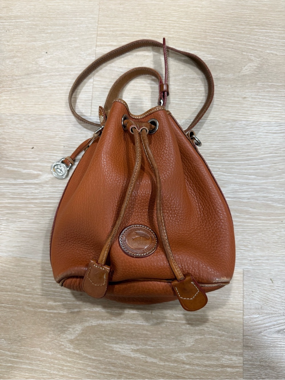 Dooney & Bourke Cognac Pebbled Leather Drawstring Mini Bucket Bag